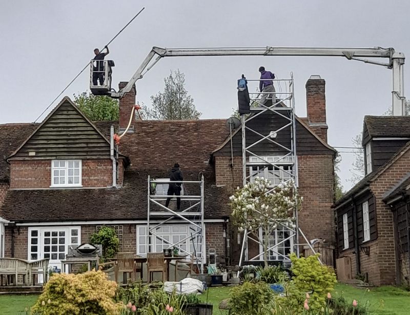 The Moss Cleaners using cherry picker and scaffolding to clean roof safely and professionally in 31 Stanmore Hill, Stanmore, UK, 31 Stanmore Hill, Stanmore, UK
